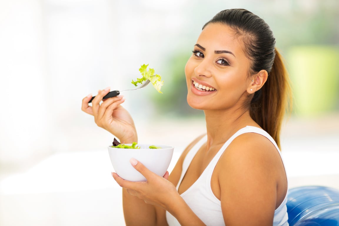 pretty woman eating healthy food